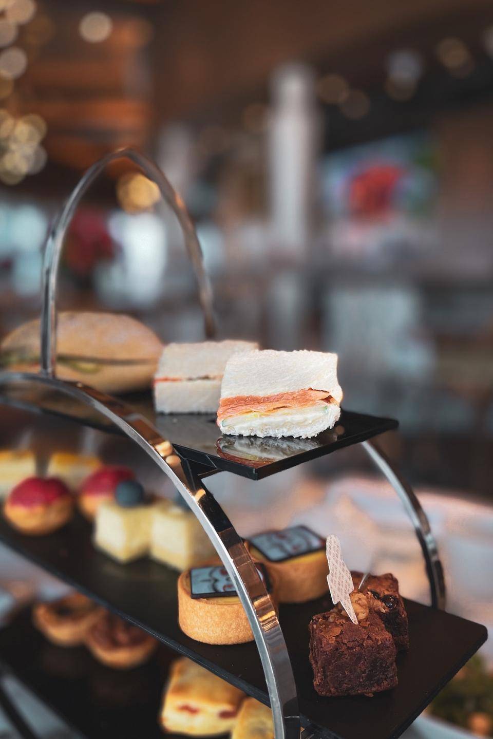 A tiered stand holding assorted confections