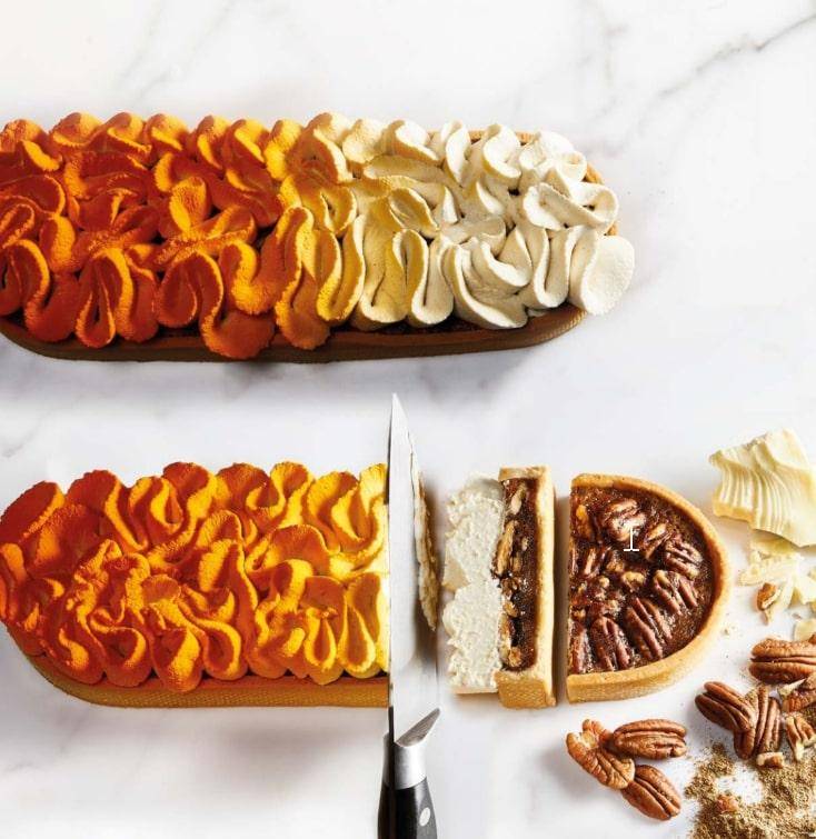 Fall-themed pastry on a white marble background