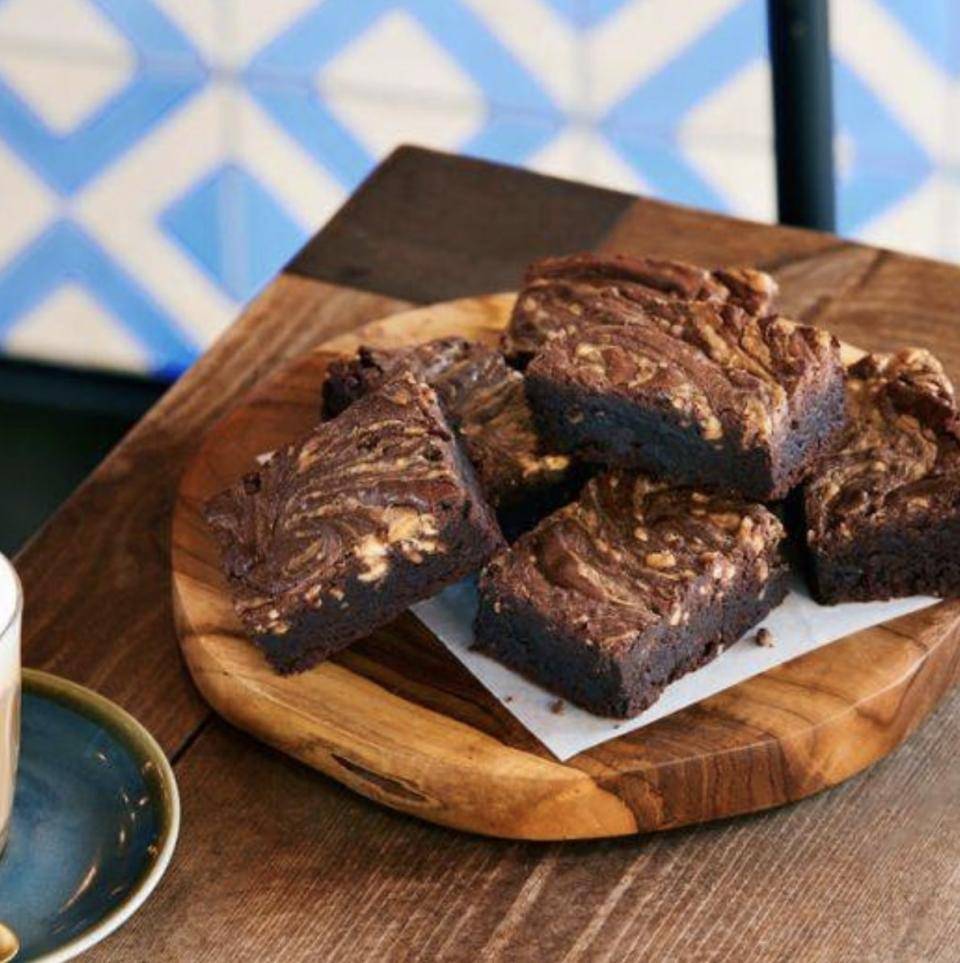 chocolate brownies on a wood table