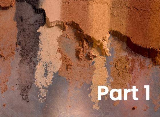 A range of different cocoa powders side by side on a flat surface, it is easy to see the variety of colours and texures