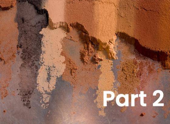 A range of different cocoa powders side by side on a flat surface, it is easy to see the variety of colours and texures