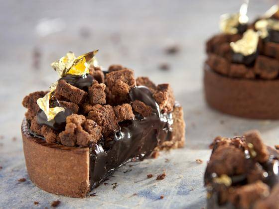 A streusel- and gold leaf-topped chocolate tart