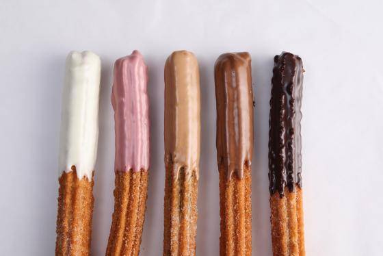 Churros coated with different ganache flavors